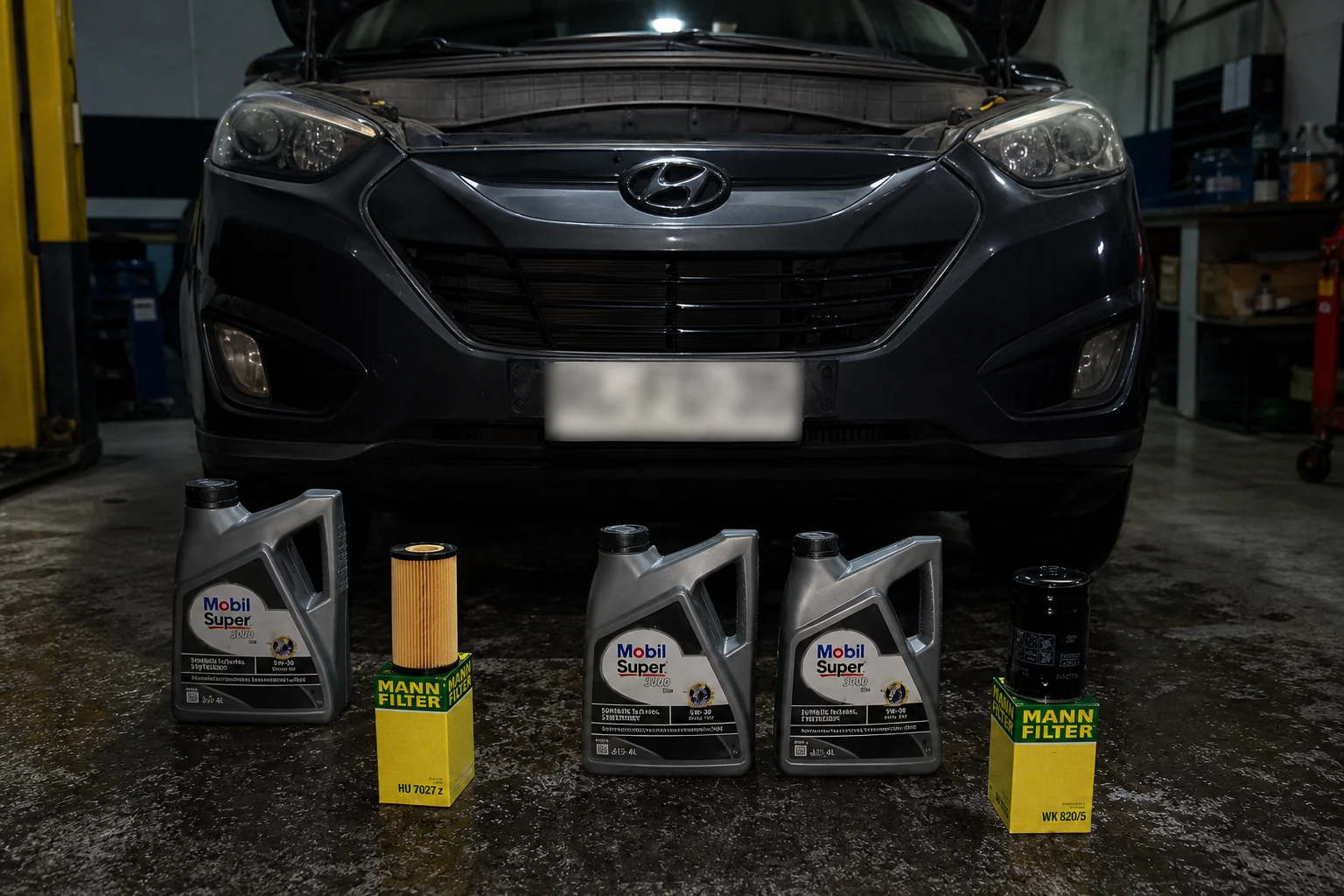 Hyundai Tucson en el taller con aceite y filtros preparados para su mantención